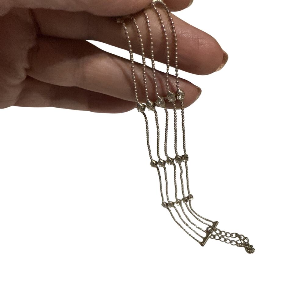 A gold-toned, multi-strand rhinestone bracelet